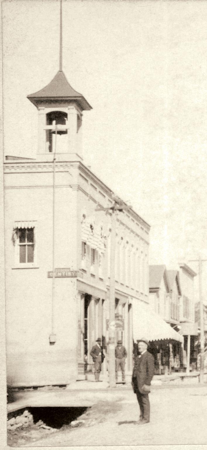 Reuss Building with bell in downtown Naperville, late nineteenth century
