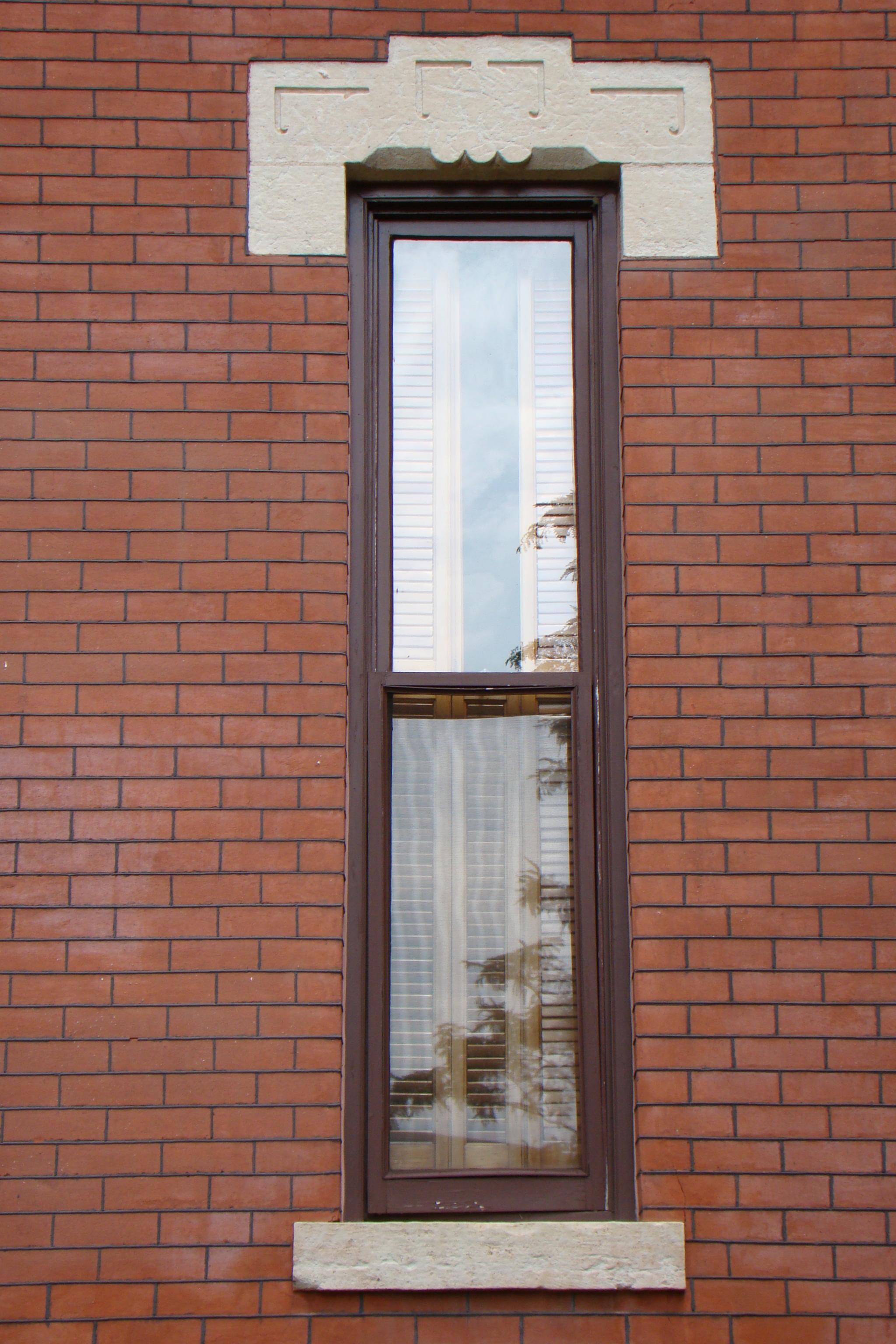 Window with decorative stone arch, Martin-Mitchell Mansion