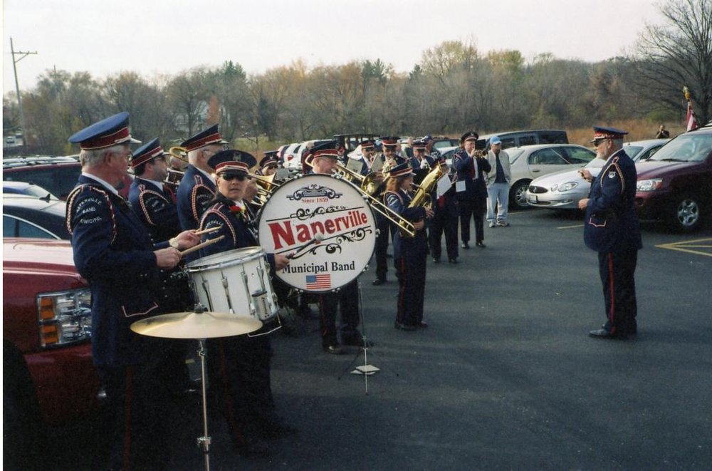 Photograph of musical band preparing to play